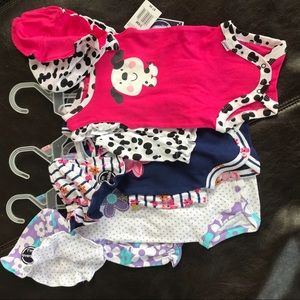 Lot of 3 Gerber baby girl outfit sets.